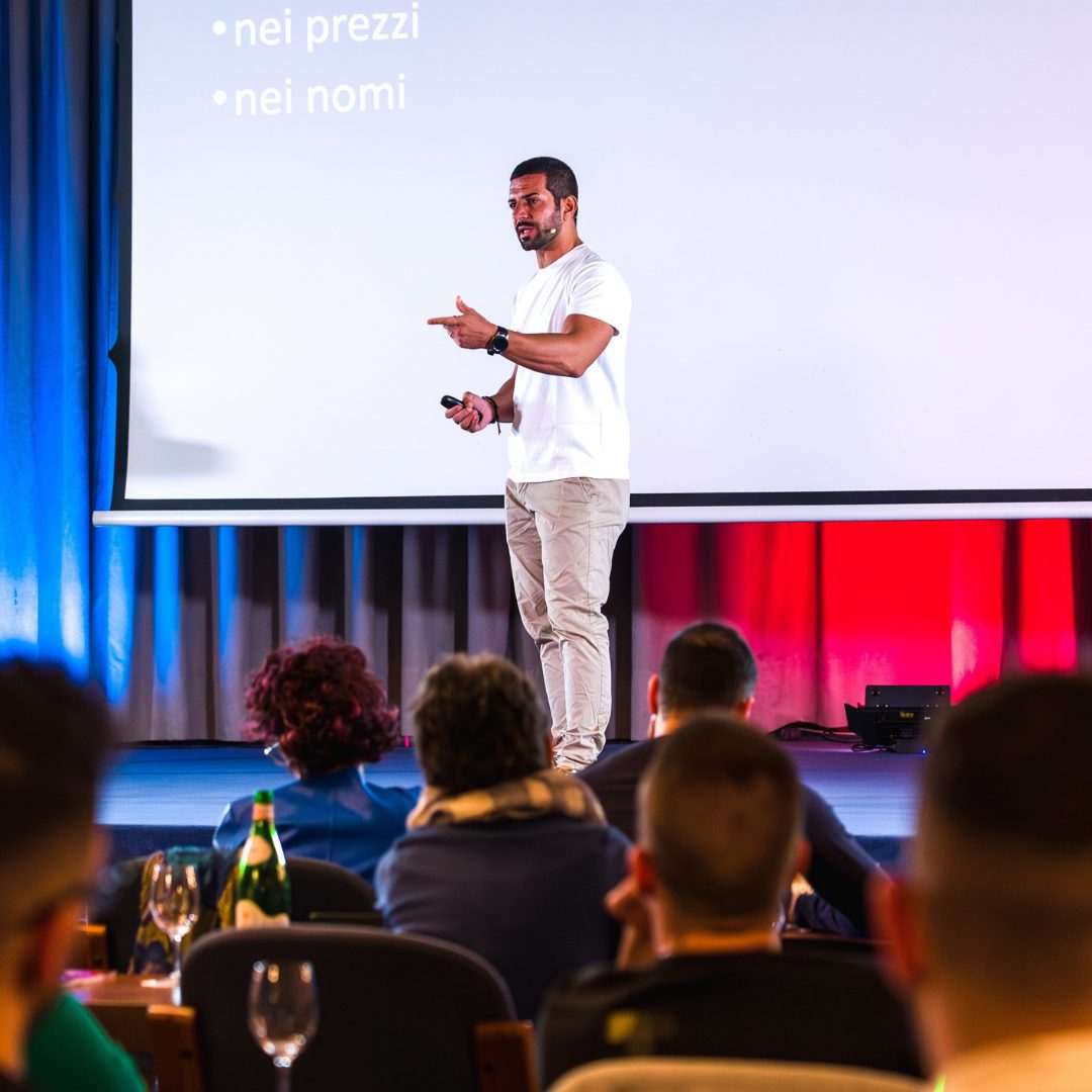 Ilias Contreas speaking on stage